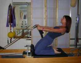 Susan Spero Pilates reformer lean back